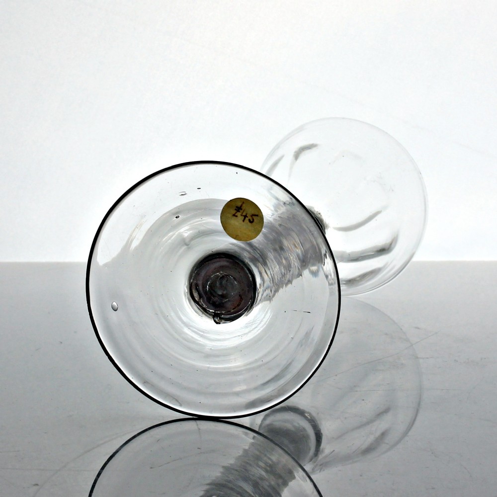 A Georgian clear glass wine glass featuring a flute-moulded rounded funnel bowl, a double series opaque twist stem, and a flat conical foot. View IV