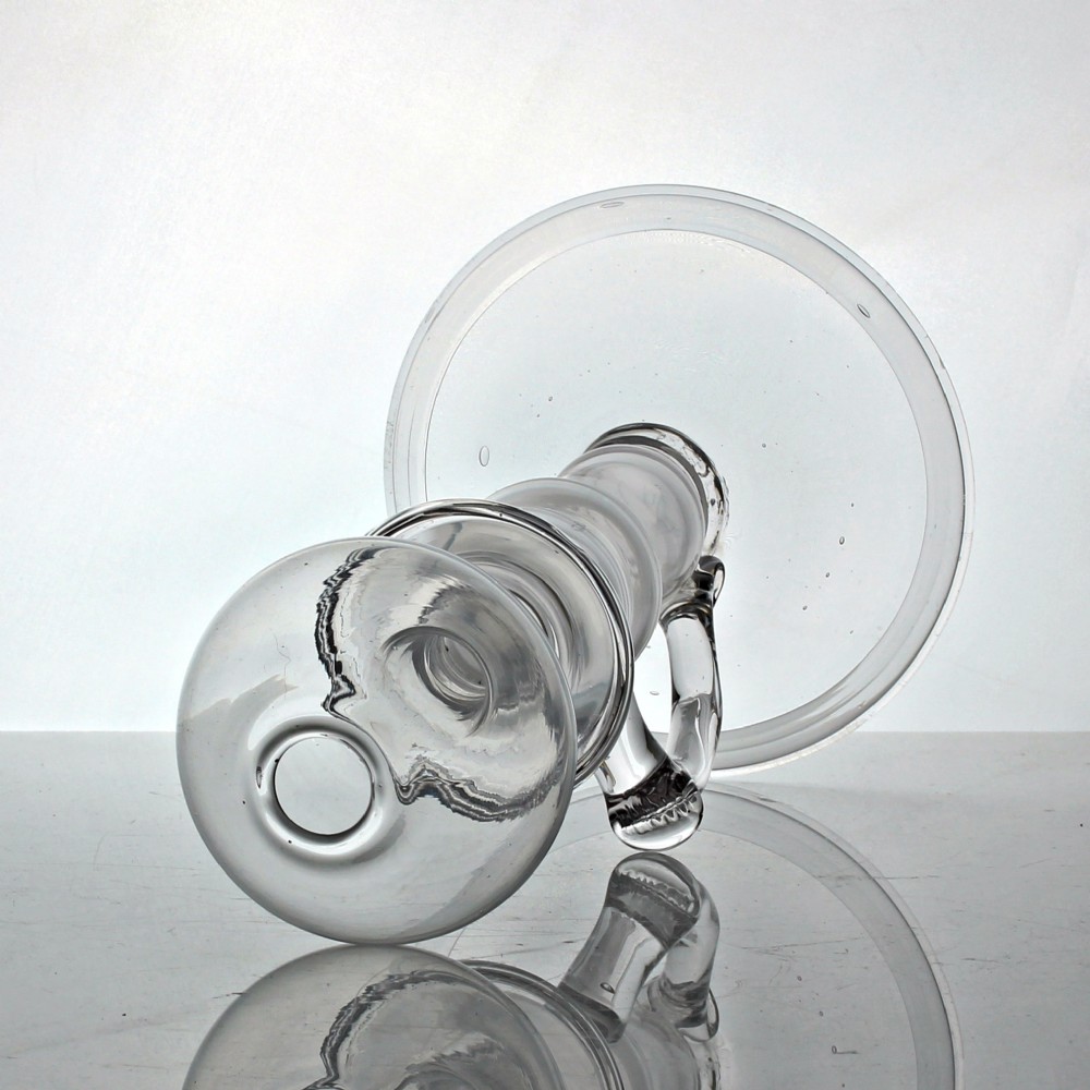 A tall clear hand-blown glass Georgian oil lamp featuring a bulbous top reservoir, a drip tray, a baluster stem, and an applied side handle on a broad circular foot. View III