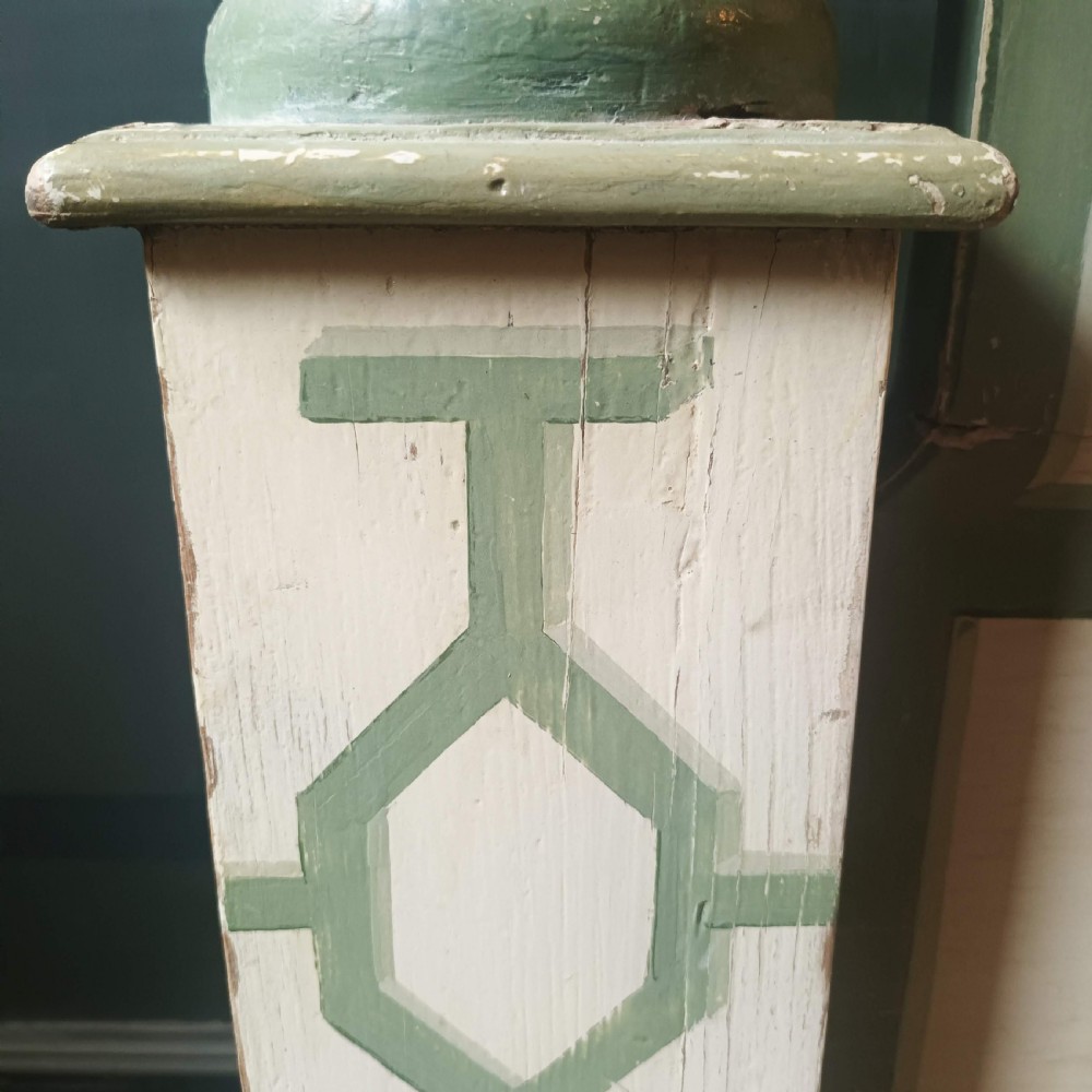 A cream-painted Edwardian four-poster bed frame featuring a pagoda-shaped headboard, decorative geometric fretwork, urn finials, and a painted canopy underside. View XII