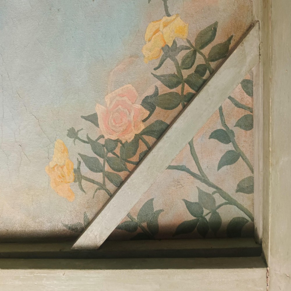 A cream-painted Edwardian four-poster bed frame featuring a pagoda-shaped headboard, decorative geometric fretwork, urn finials, and a painted canopy underside. View XXV