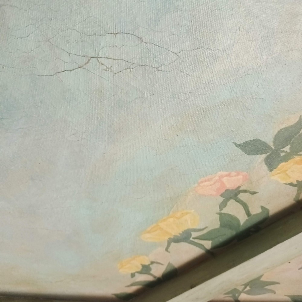 A cream-painted Edwardian four-poster bed frame featuring a pagoda-shaped headboard, decorative geometric fretwork, urn finials, and a painted canopy underside. View XXIX