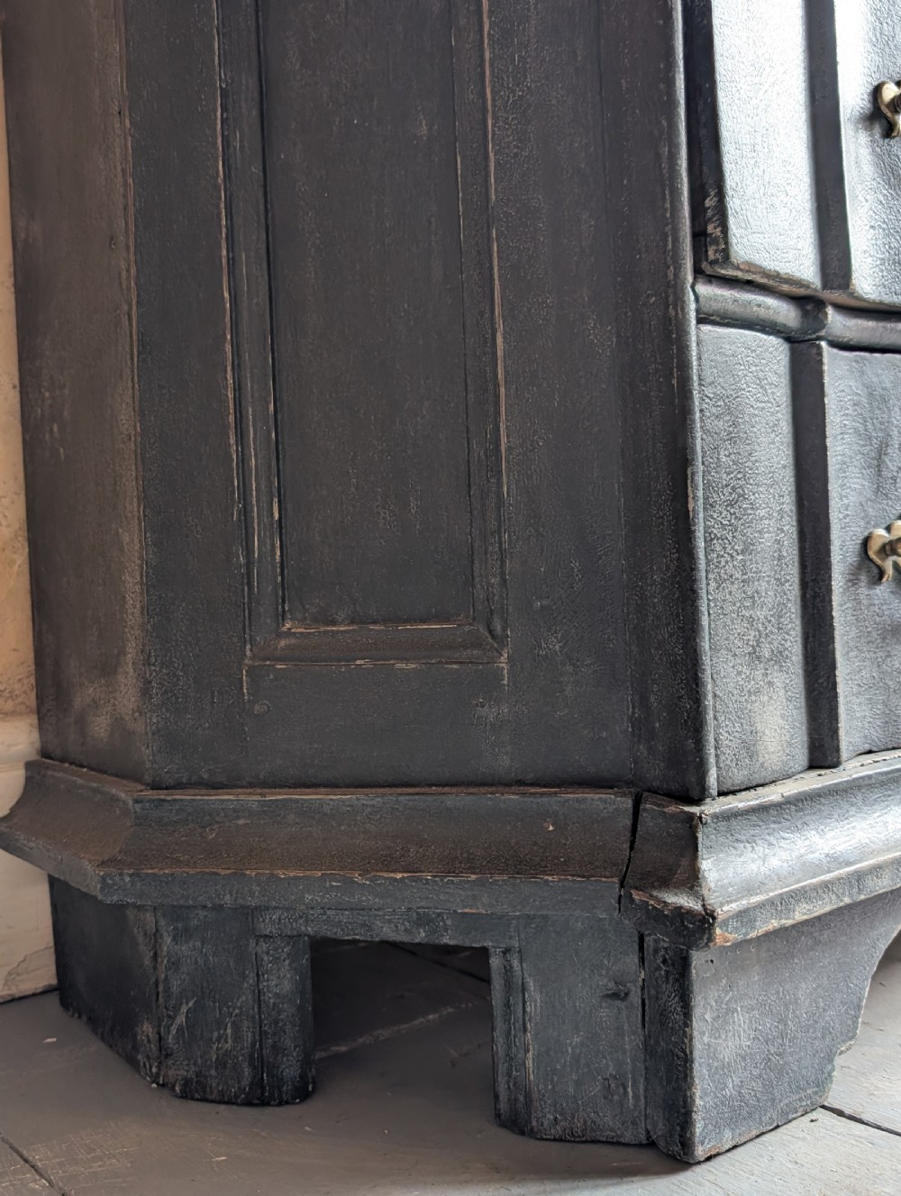 A tall dark grey painted Dutch vitrine cabinet featuring a shaped top hood, glazed upper doors, and three lower drawers with brass handles. View XVII