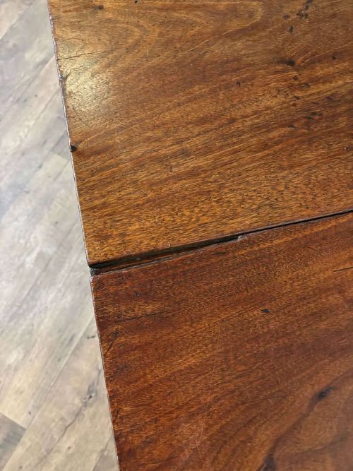 fig 4. A Georgian mahogany drop leaf table with two extended hinged flaps and reeded square legs.
