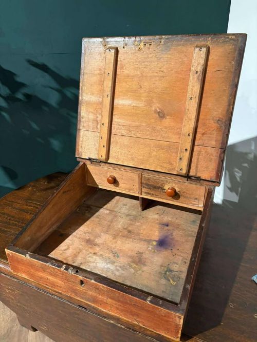 fig 4. A Victorian pine tabletop clerk desk with a slanted hinged lid, front keyhole, and carved decorative gallery back panel.