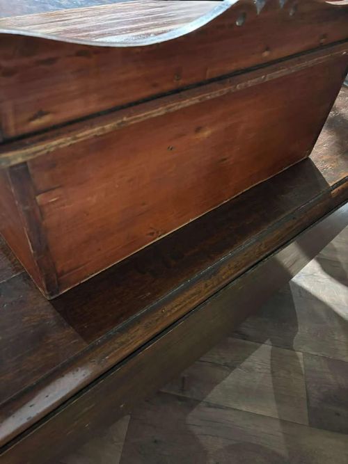 fig 5. A Victorian pine tabletop clerk desk with a slanted hinged lid, front keyhole, and carved decorative gallery back panel.