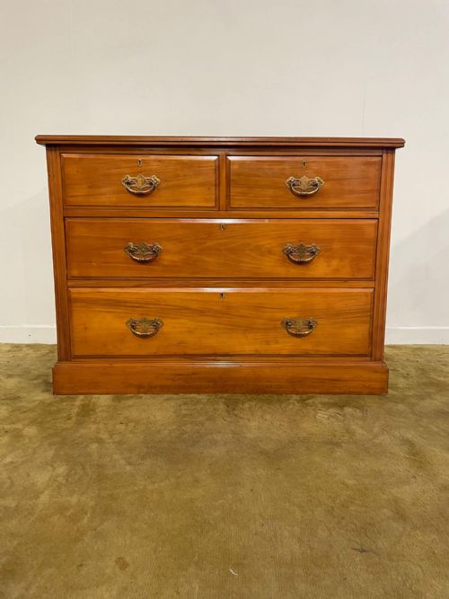fig 2. An Edwardian satinwood chest of drawers with two short drawers over two long drawers, fitted with brass drop handles and a low rear upstand.