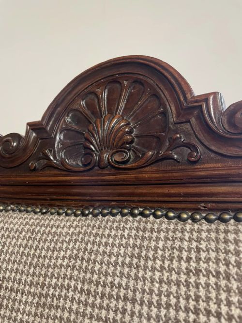 fig 4. A set of four dark timber Victorian dining chairs featuring carved shell crests, turned front legs, and patterned houndstooth fabric upholstery.