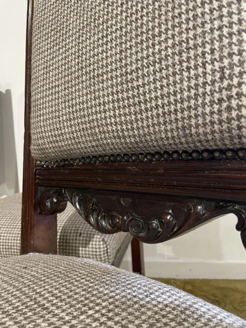 fig 5. A set of four dark timber Victorian dining chairs featuring carved shell crests, turned front legs, and patterned houndstooth fabric upholstery.