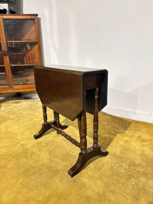 Edwardian mahogany table of small proportions resting on turned legs.(Regent St, Goodyers London.W.)