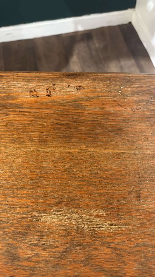 fig 2. A square dark oak window table featuring distinct turned legs with central bulbous knops and a lower perimeter box stretcher.