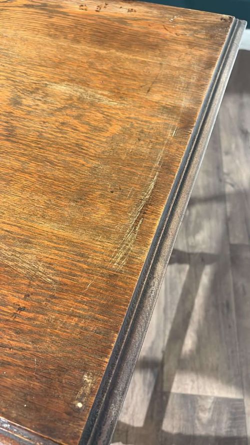 fig 8. A square dark oak window table featuring distinct turned legs with central bulbous knops and a lower perimeter box stretcher.