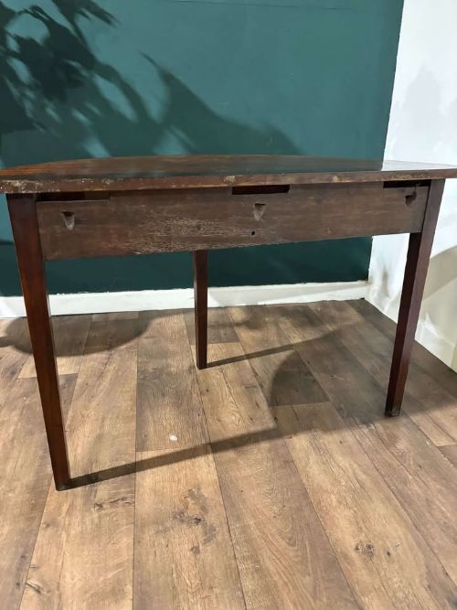 fig 8. A semi-circular antique mahogany D-end table with four square tapered legs and a polished timber top.