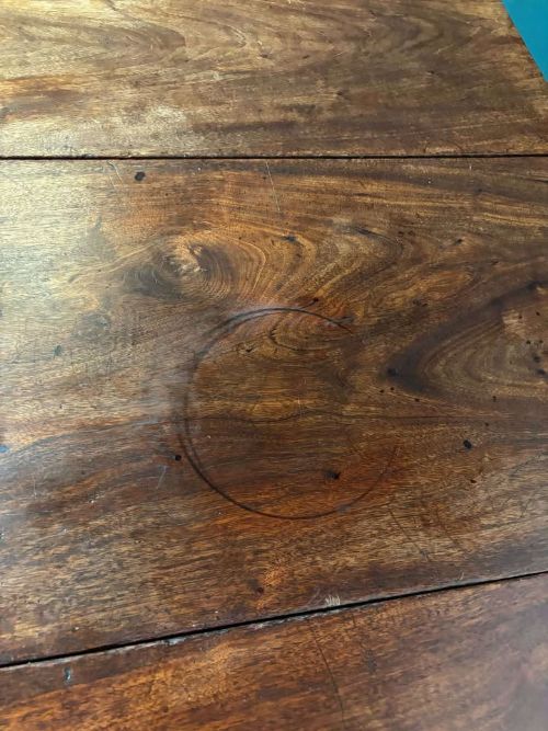 fig 1. An antique Georgian dark mahogany drop-leaf table shown standing fully extended on straight moulded legs.