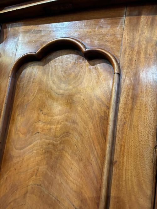 fig 6. A Victorian mahogany chiffonier cabinet featuring a scroll-carved splashback shelf over a two-door cupboard set on a solid plinth base.