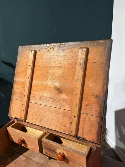 fig 1. A Victorian pine tabletop clerks desk with a sloped hinged lid, keyhole, and a carved gallery edge across the top.