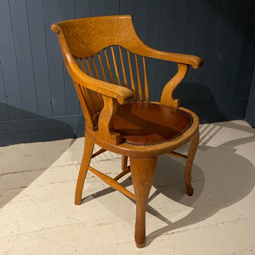 An Edwardian Blonde Oak and Leather Desk Chair