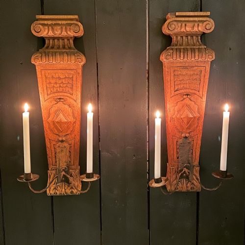 A Large Pair of Oak and Wrought Iron Wall Sconces