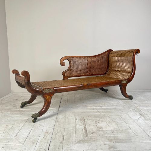 A Regency Simulated Rosewood and Cane Chaise Longue