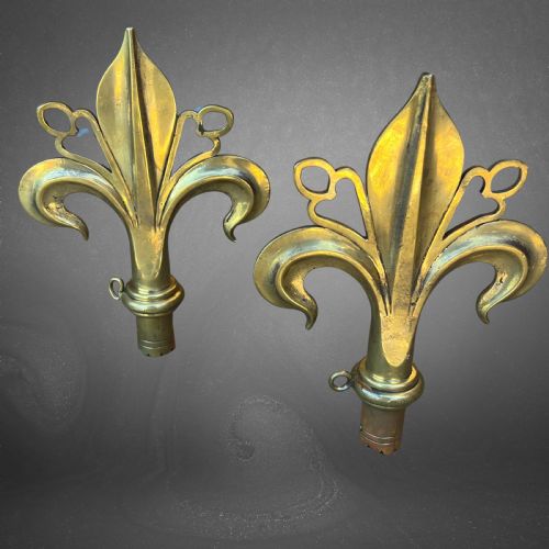 A Pair of Arts & Crafts Polished Bronze Fleur De Lys Pole Ends or Finials