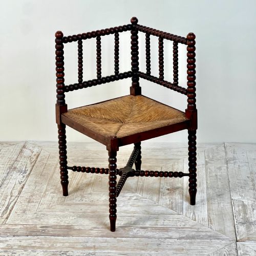 A 19th Century Corner Bobbin Chair with Rush Seat