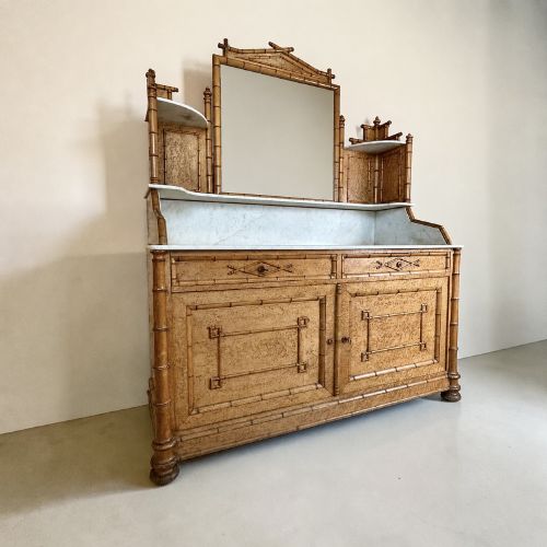 fig 1. Late 19th-century French faux-bamboo birds-eye maple washstand featuring a central mirror, side shelf tiers, marble splashback and surface, over two drawers and a double cupboard.