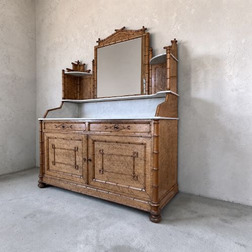 fig 2. Late 19th-century French faux-bamboo birds-eye maple washstand featuring a central mirror, side shelf tiers, marble splashback and surface, over two drawers and a double cupboard.
