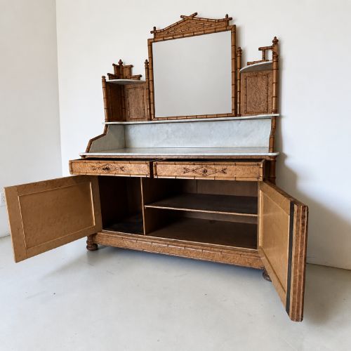 fig 3. Late 19th-century French faux-bamboo birds-eye maple washstand featuring a central mirror, side shelf tiers, marble splashback and surface, over two drawers and a double cupboard.
