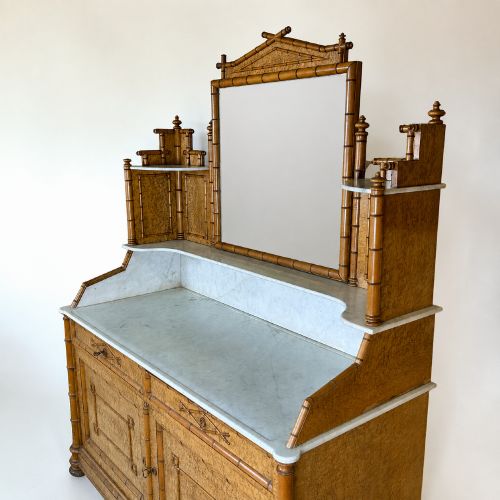 fig 4. Late 19th-century French faux-bamboo birds-eye maple washstand featuring a central mirror, side shelf tiers, marble splashback and surface, over two drawers and a double cupboard.