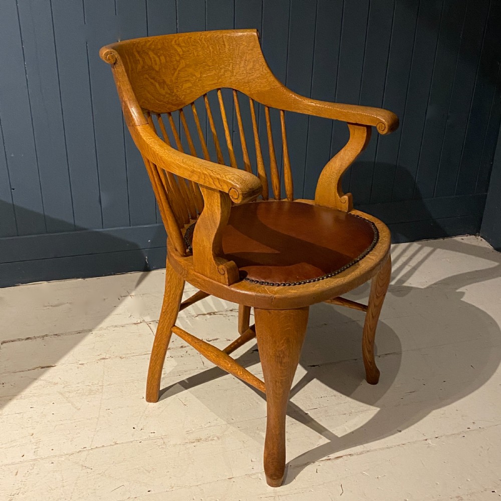 An Edwardian Blonde Oak and Leather Desk Chair