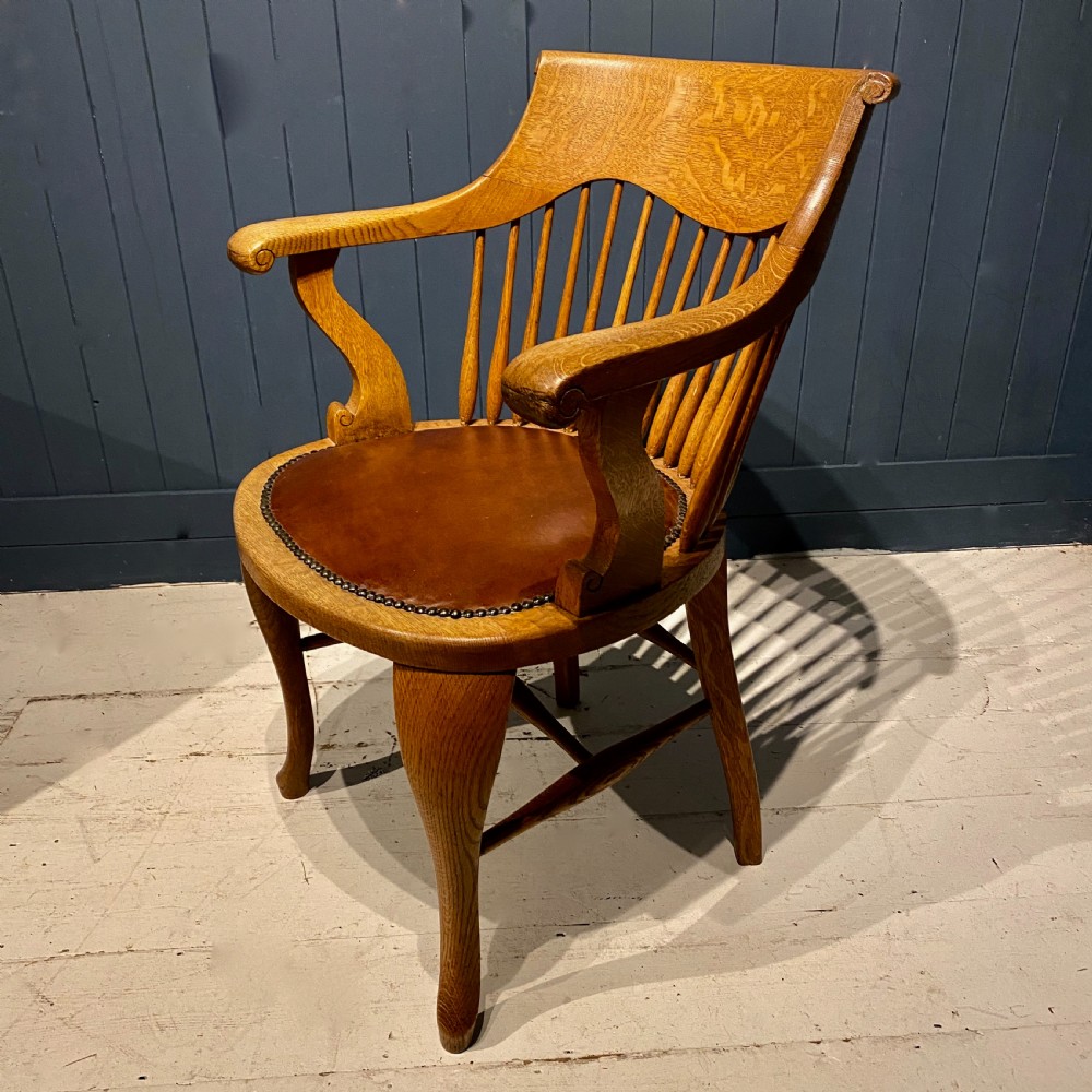 An Edwardian Blonde Oak and Leather Desk Chair View II