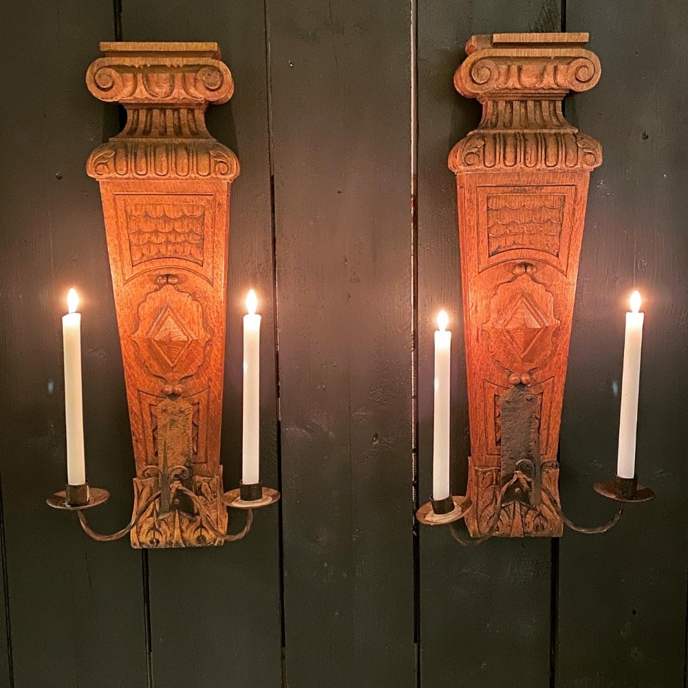 A Large Pair of Oak and Wrought Iron Wall Sconces
