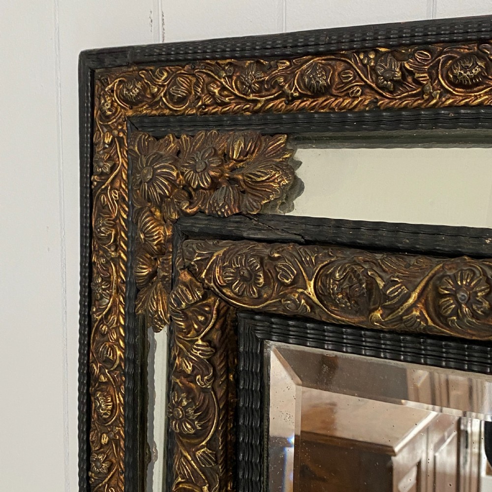 A Repousse Brass and Ebonised Cushion Mirror View IV