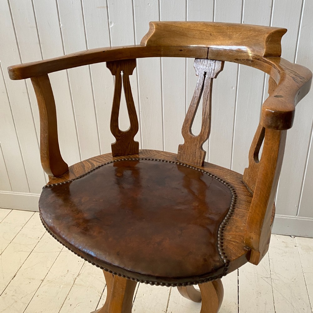 An Elm and Leather Swivel Desk Chair  View II