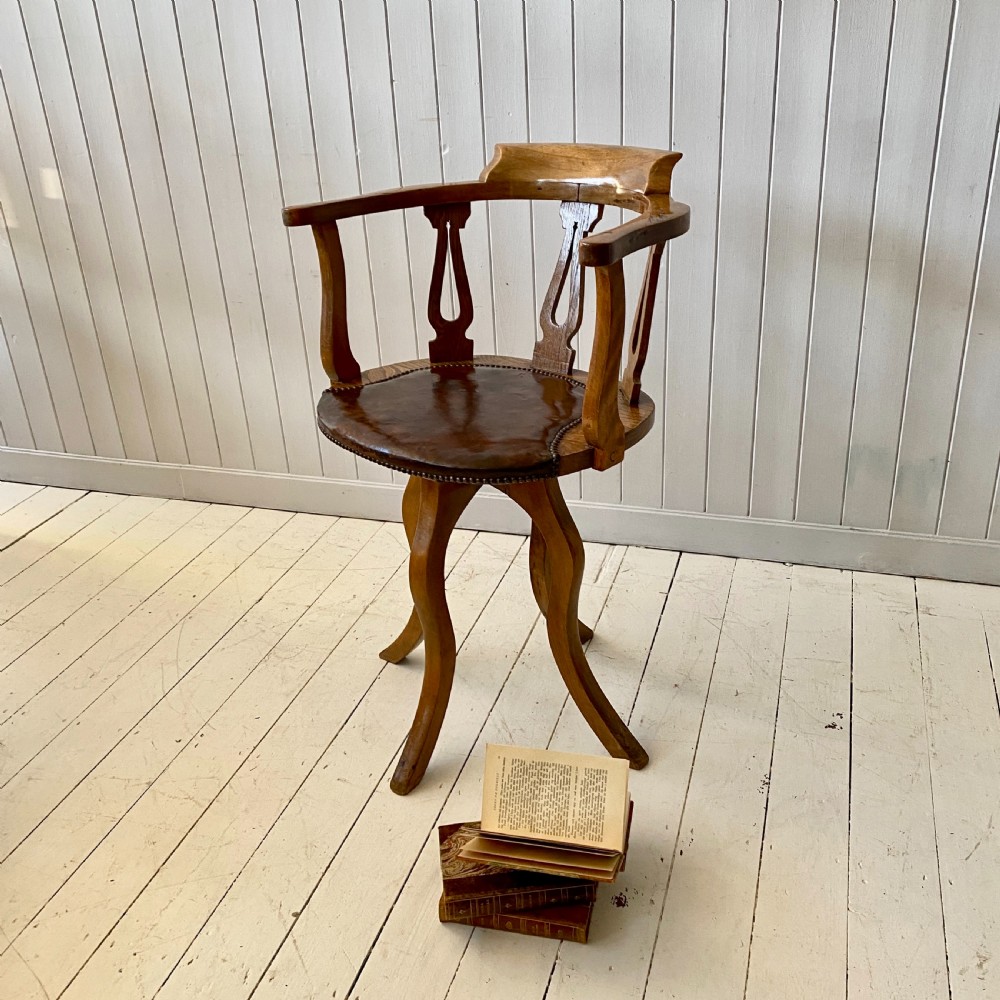An Elm and Leather Swivel Desk Chair  View IV