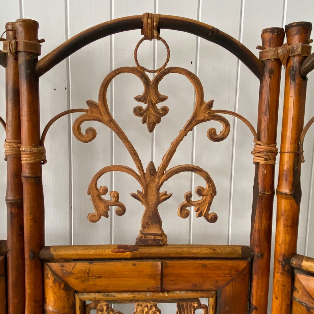 A Vintage Bamboo and Inset Iron Three Fold Screen View VIII