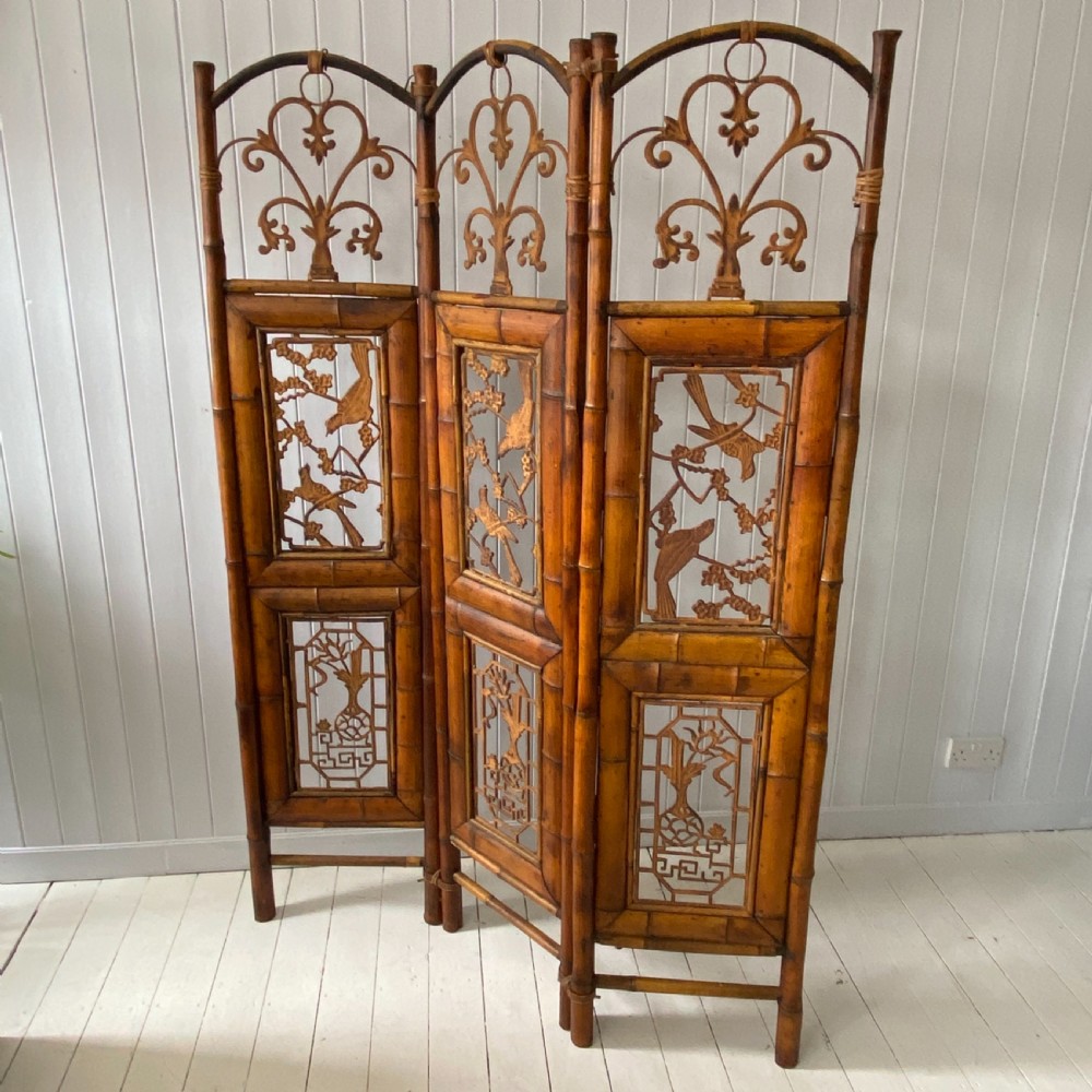 A Vintage Bamboo and Inset Iron Three Fold Screen View IX