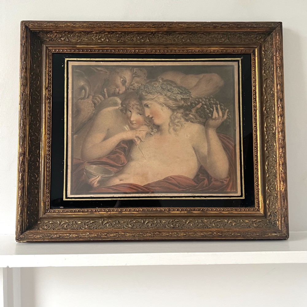 An 18th-century classical etching depicting Eros and mythological figures, mounted in a dark border and an ornate gilded frame.