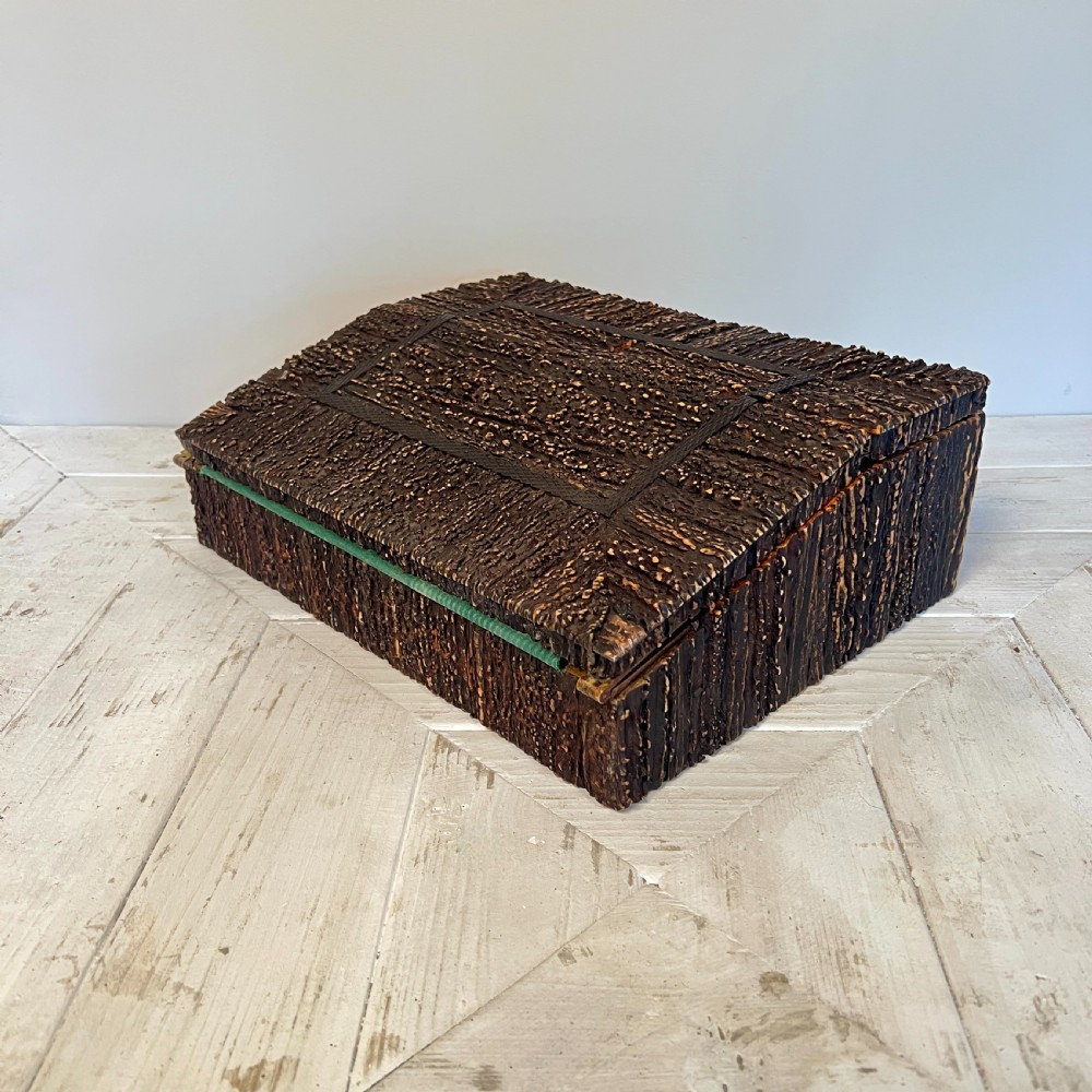 An open nineteenth-century Anglo-Indian writing slope displaying carved antler borders, floral bone inlay, and a green velvet writing surface. View III