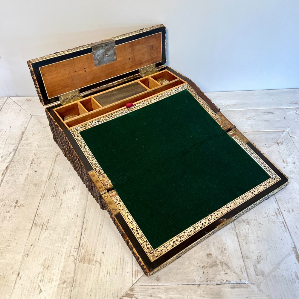 An open nineteenth-century Anglo-Indian writing slope displaying carved antler borders, floral bone inlay, and a green velvet writing surface. View IV
