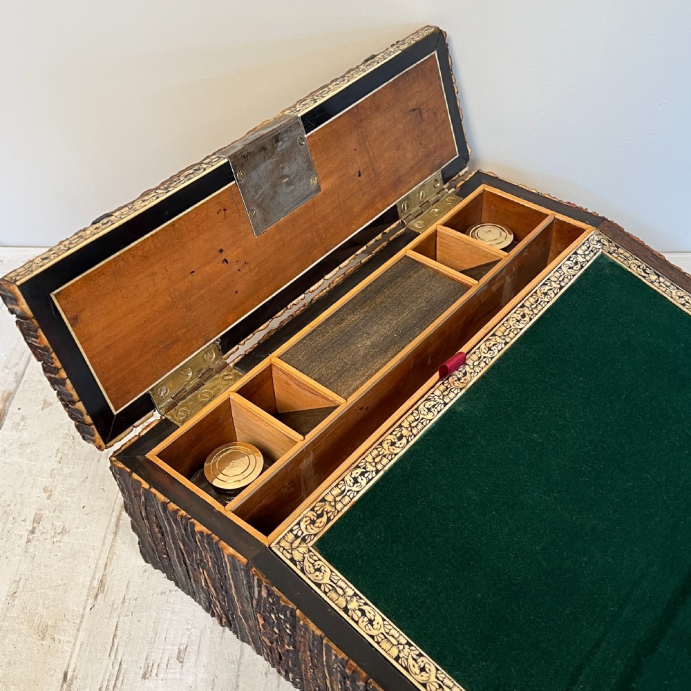 An open nineteenth-century Anglo-Indian writing slope displaying carved antler borders, floral bone inlay, and a green velvet writing surface. View V