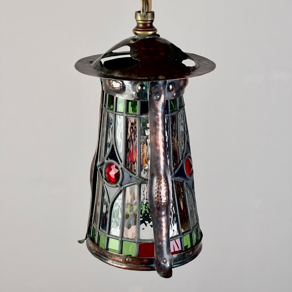 An Arts And Crafts Patinated Copper And Leaded Glass Hall Lantern View III