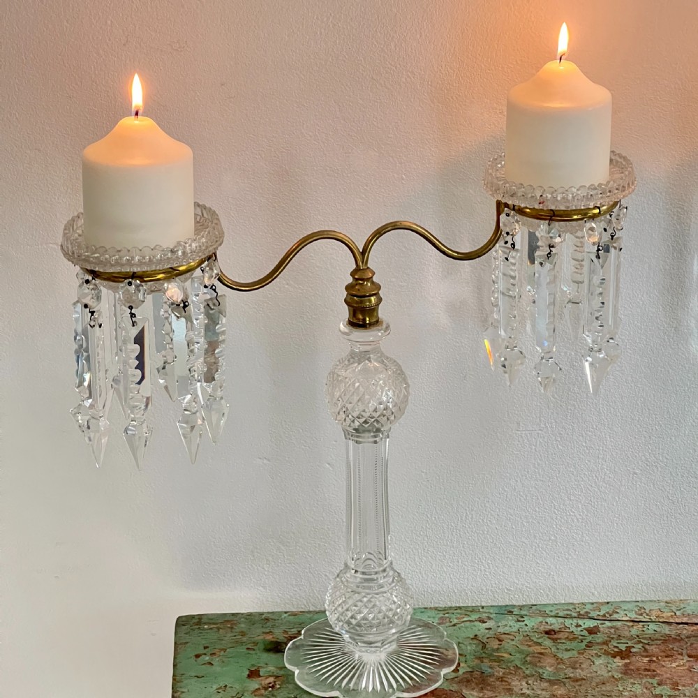 A pair of late Victorian two-light cut glass and brass Cricklite candelabra featuring suspended crystal prisms and clear glass pedestals. View III
