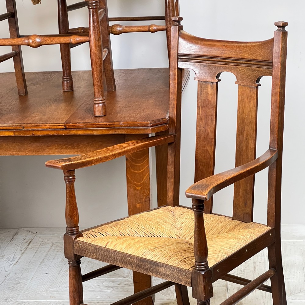 An Arts & Crafts Extending Oak Dining Table & Six Chairs View II