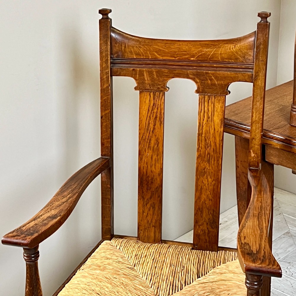 An Arts & Crafts Extending Oak Dining Table & Six Chairs View III