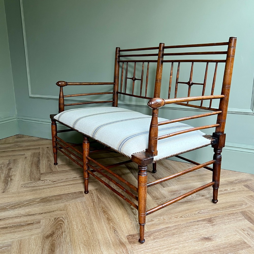 A Rare Walnut Two Seater Argyle Settee By Liberty & Co. London