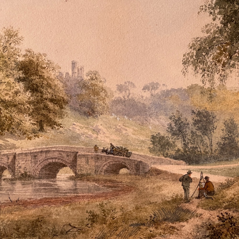 A framed Victorian watercolour painting depicting Windsor Castle beyond a river and stone bridge, framed in a gold-toned wooden frame with a cream mount. View V