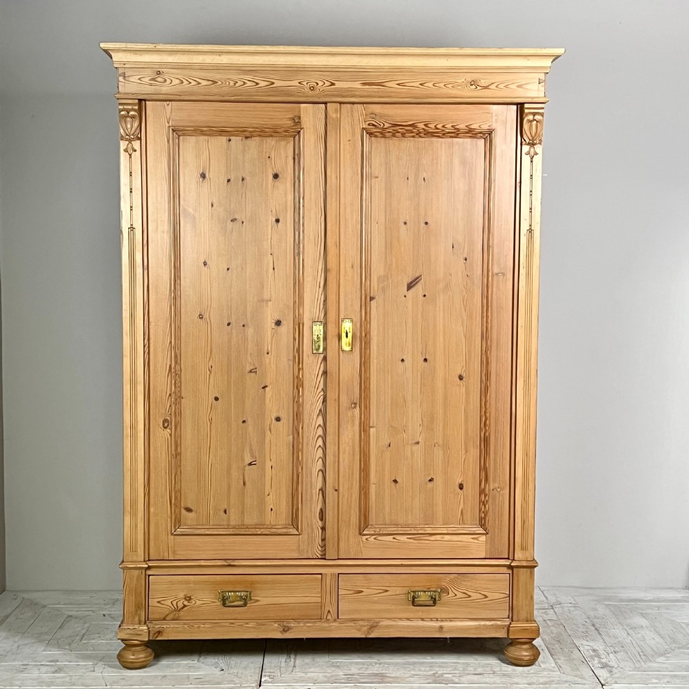 A Continental Pine Art Nouveau Knockdown Wardrobe