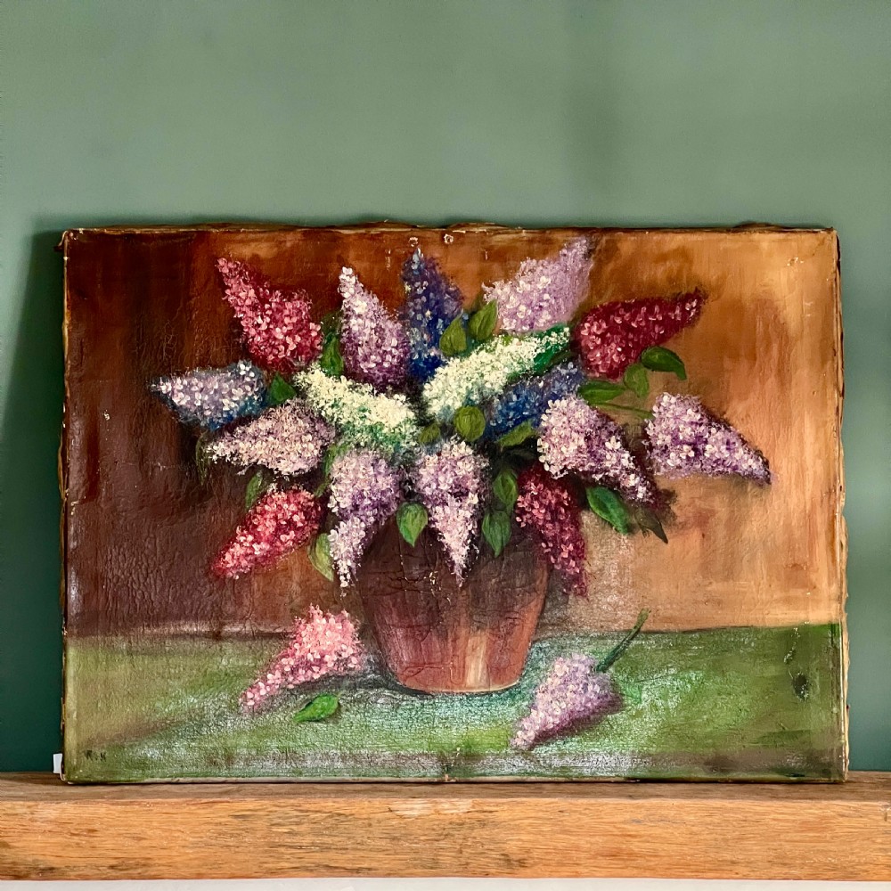 A textured impasto oil painting on canvas depicting a arrangement of purple, pink, and white lilacs in a brown vase.