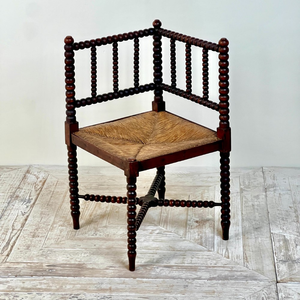A 19th Century Corner Bobbin Chair With Rush Seat