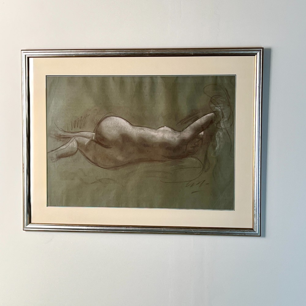 A framed charcoal and chalk life study drawing depicting a reclining female nude figure on toned paper. View II